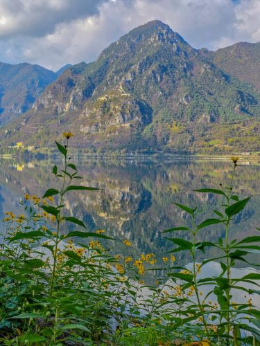 Italian autumn with mountain reflection in lake